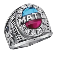 A silver ring with the name MATT across the top, surrounded by clear stones, and featuring a blue and red gem in the center.